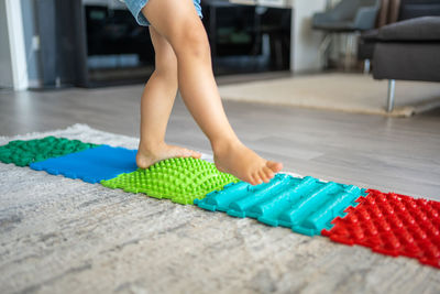 Low section of woman standing on floor