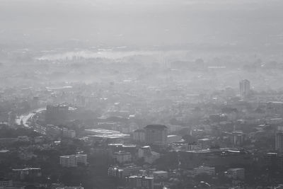 Aerial view of cityscape against sky