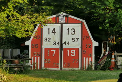 Red information sign on field