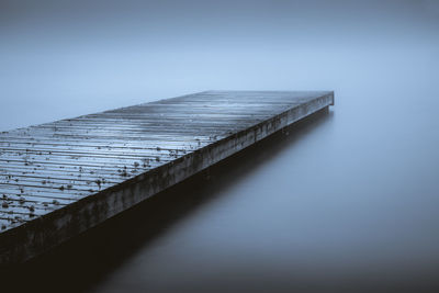 Pier over sea against clear sky