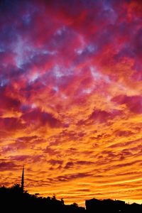 Low angle view of dramatic sky during sunset