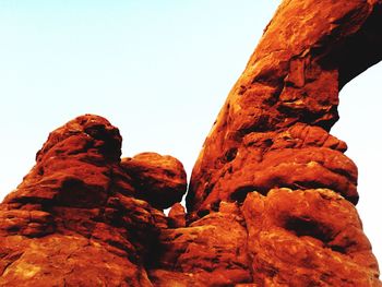 Low angle view of rocky mountain against sky