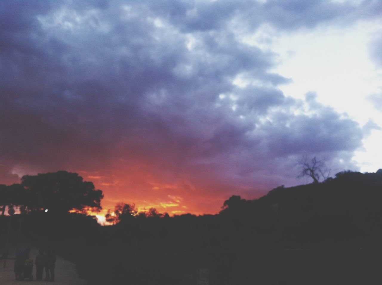 sky, silhouette, cloud - sky, cloudy, sunset, beauty in nature, scenics, tranquil scene, tranquility, tree, nature, cloud, dramatic sky, weather, landscape, dusk, overcast, idyllic, low angle view, outdoors