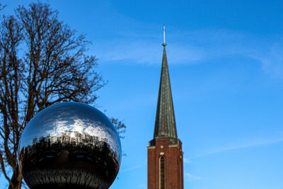 Low angle view of building against blue sky