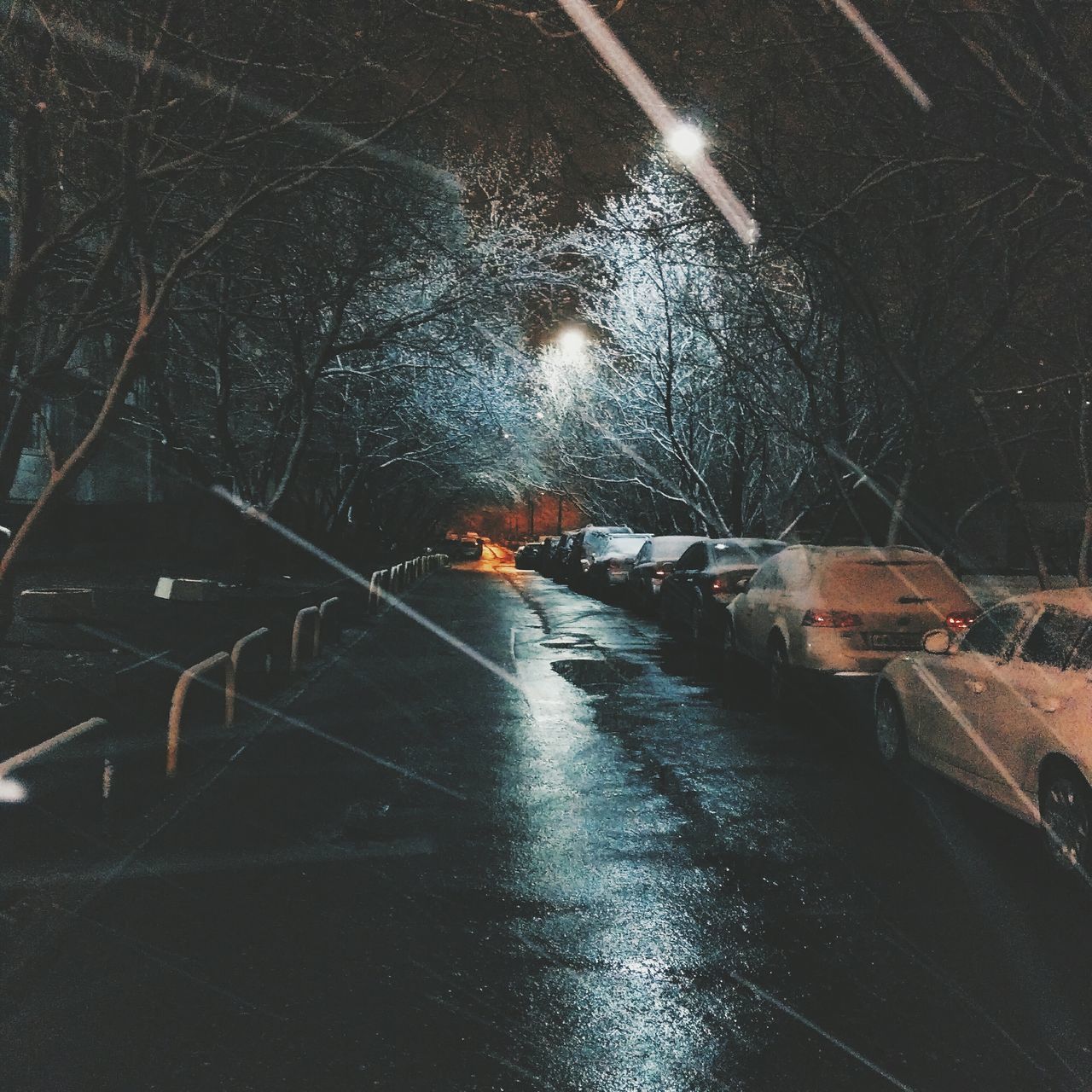 transportation, the way forward, road, street, night, wet, land vehicle, car, mode of transport, illuminated, road marking, rain, diminishing perspective, vanishing point, weather, street light, high angle view, water, asphalt, built structure