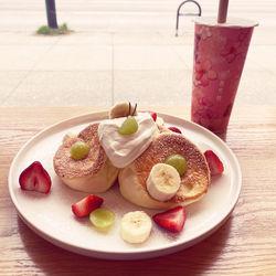 View of soufflés/dessert in plate on table, with bubble tea