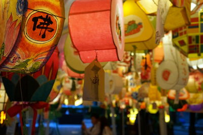 Close-up of lanterns hanging at night