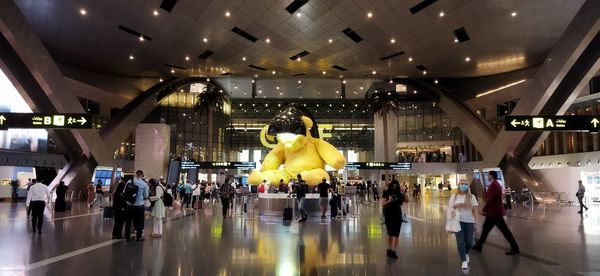 Group of people walking in airport