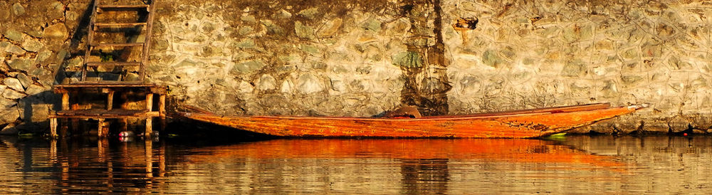 Boat moored in lake