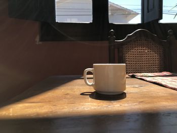 Close-up of coffee cup on table