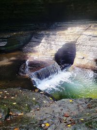 Water flowing through rocks in forest