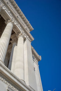 Low angle view of building against blue sky