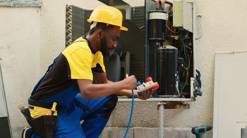 Side view of man working at construction site