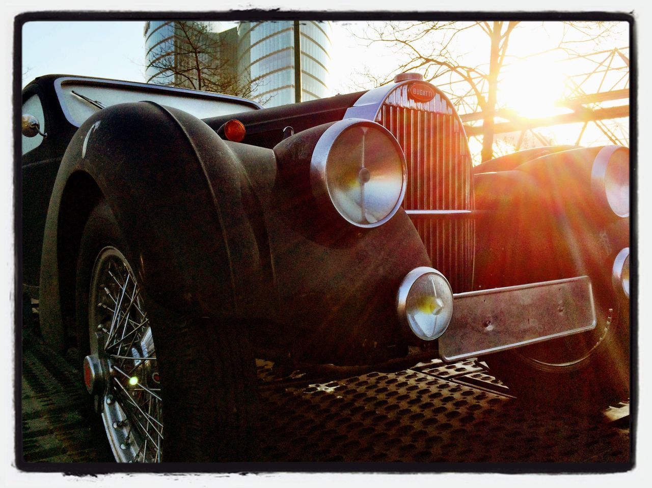 CLOSE-UP OF VINTAGE CAR ON MOTORCYCLE