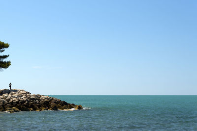 Scenic view of sea against clear sky