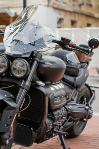 Front view of black motorcycle with helmet on it