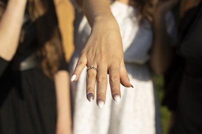 Midsection of people stacking hands