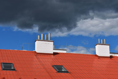 Low angle view of building against cloudy sky