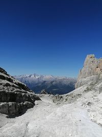 Scenic view of mountains against clear blue sky