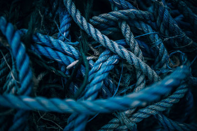Close-up high angle view of tangled blue ropes