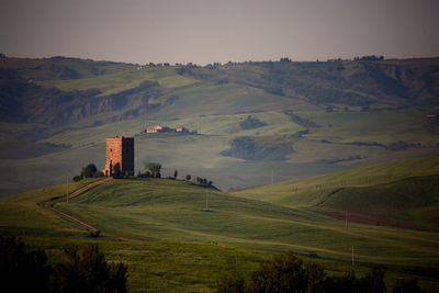 Scenic view of farm against sky