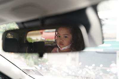 Portrait of boy in car