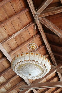 Low angle view of chandelier hanging on ceiling