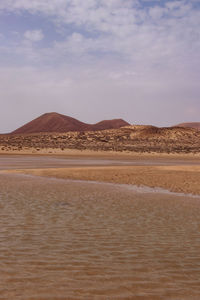 Scenic view of desert against sky