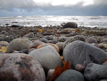 Scenic view of sea against cloudy sky