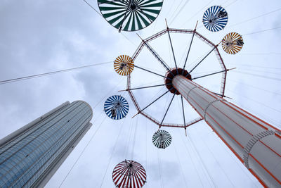 Low angle view of ferris wheel against sky