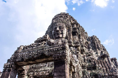 Low angle view of statue of temple against sky