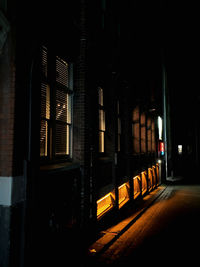 View of illuminated street and buildings at night