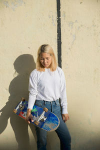 A young woman with a skateboard