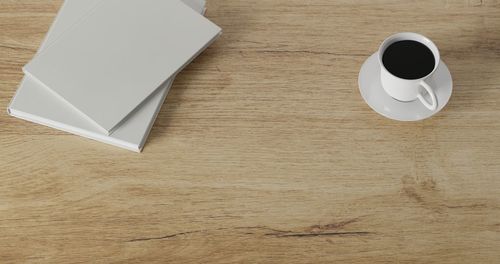 High angle view of coffee cup on table