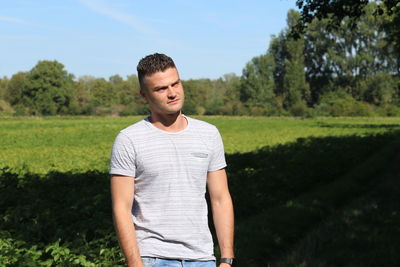 Young man standing on field