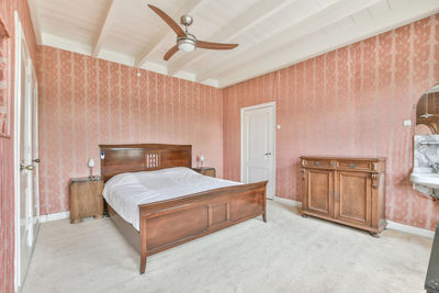 View of empty bed in bedroom