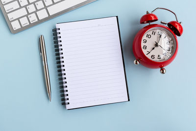 High angle view of clock on table