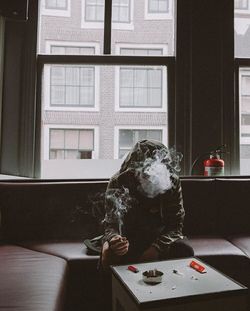 Woman with toy on table at home