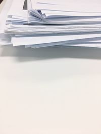 Stack of paper against white background