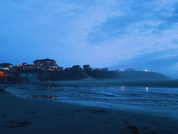 Scenic view of sea against sky at dusk