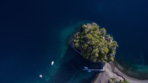 High angle view of boats in calm blue sea