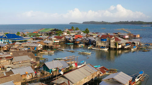 Fishing village with wooden houses on stilts in the sea. 