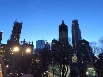 Low angle view of illuminated cityscape