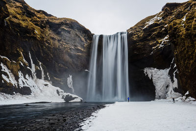 Scenic view of skogafoss waterfall during winter