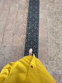 High angle view of man standing on footpath