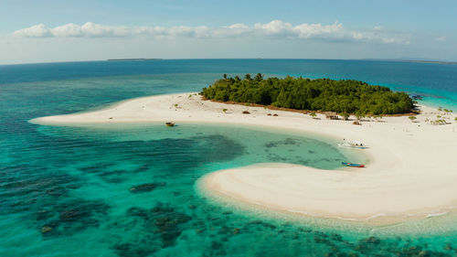 Tropical island with beautiful beach, palm trees and turquoise water.patawan island with sandy beach