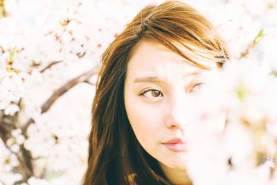 Close-up of thoughtful young woman looking away