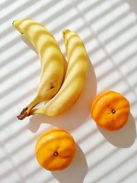 High angle view of orange, banana fruit