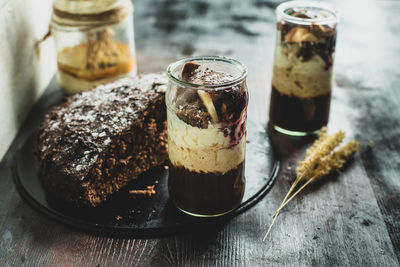 Close-up of ice cream in glass jar on table