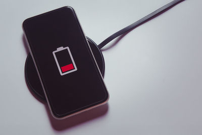 Close-up of telephone booth against white background